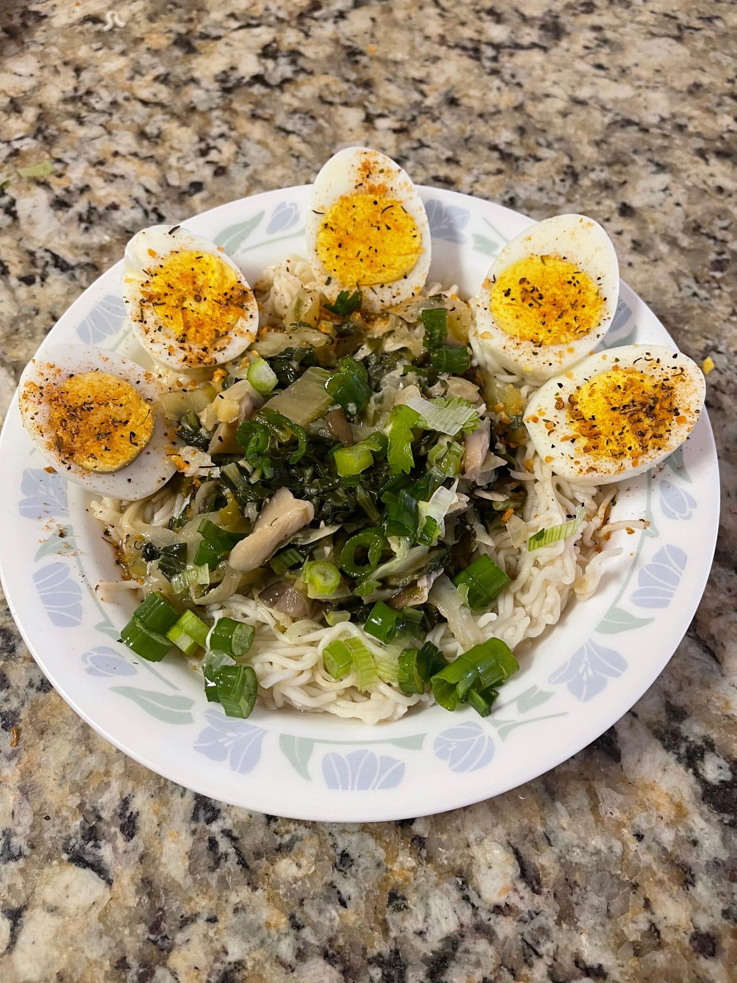 Plate of sautéed garden greens with eggs